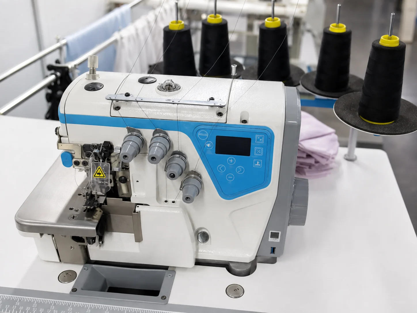Overlock finishing machine with SoftLustre silk fabric panels