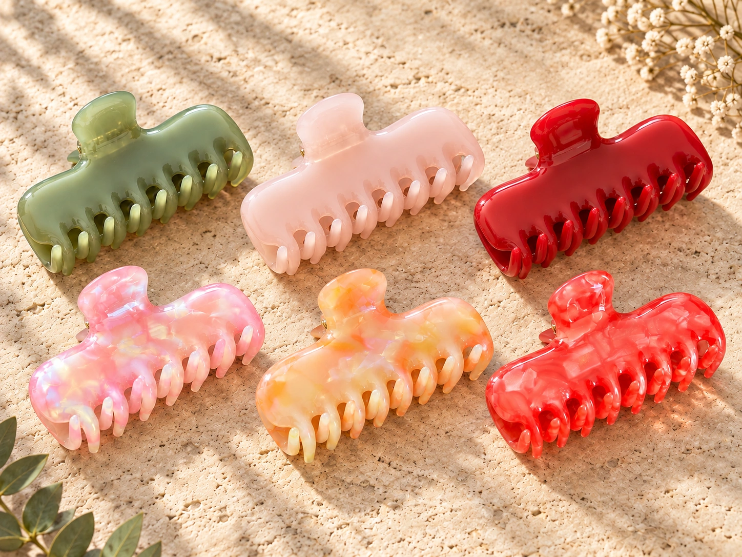 Six sculpted wave acetate claw clips arranged together