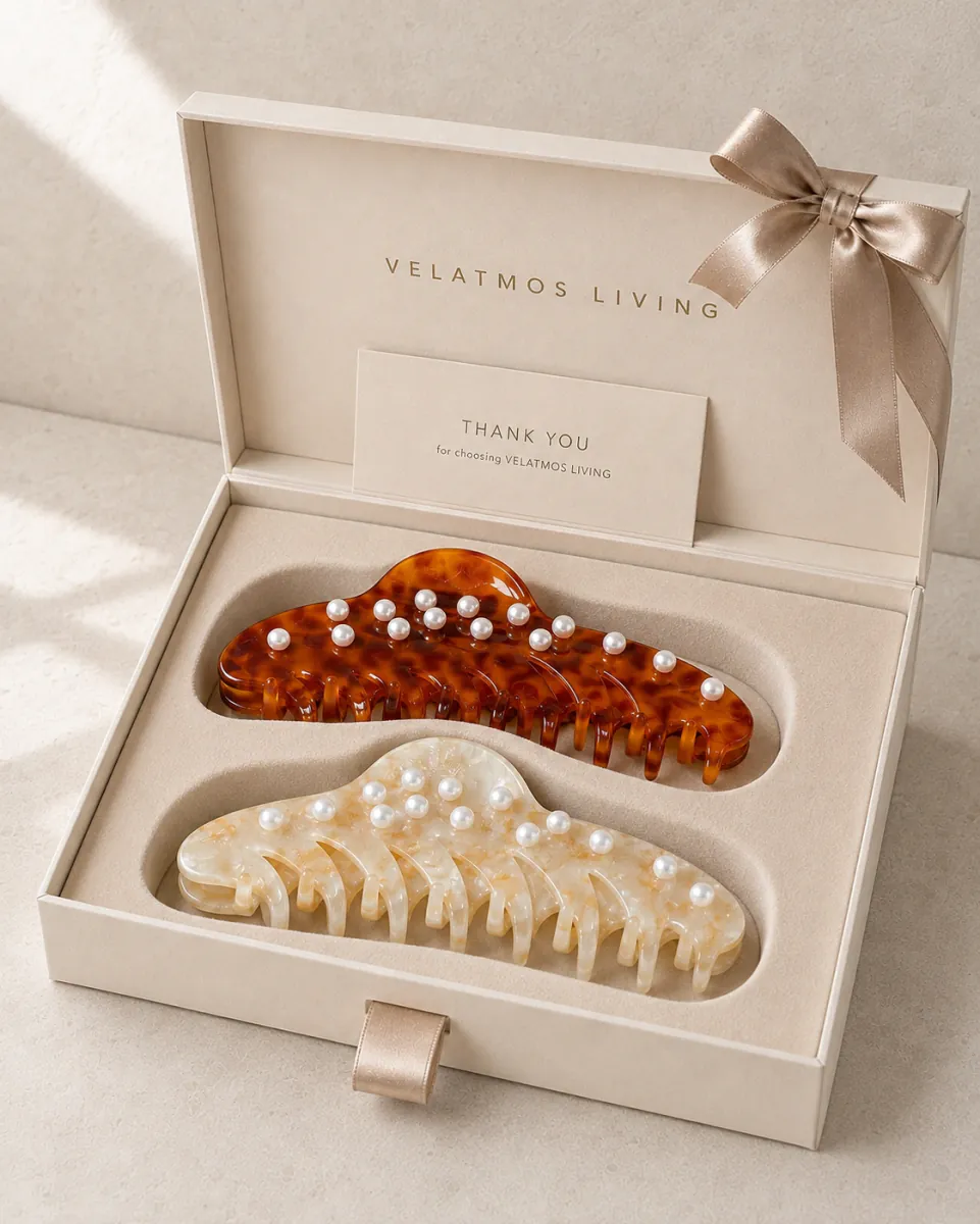 Two Pearl Cascade acetate claw clips in a fitted warm ivory gift box