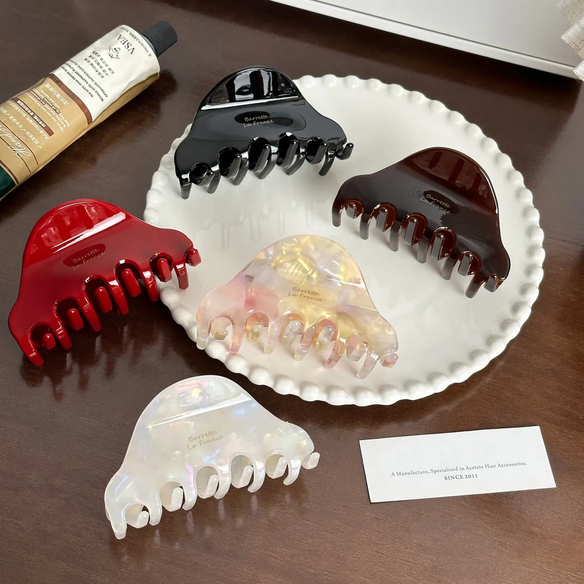 Caramel Amber, Obsidian Night, Moonlit Pearl, Blush Aurora, and Cherry Rouge Aurelia Arc acetate claw clips