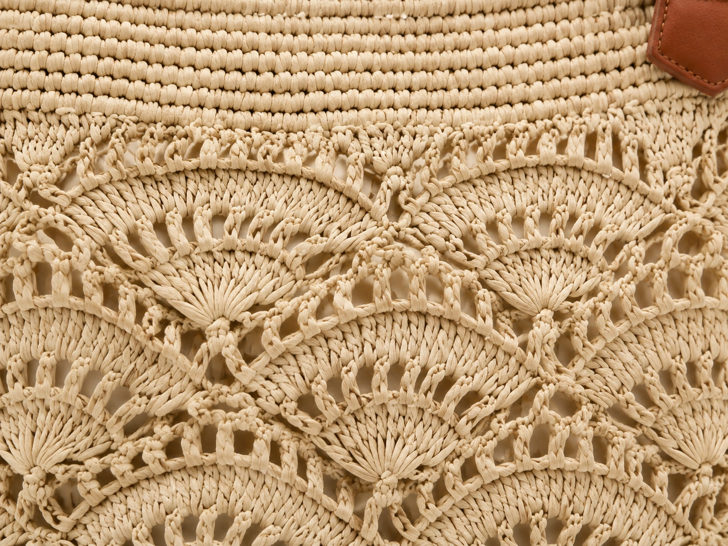 Fan openwork weave across the tote body